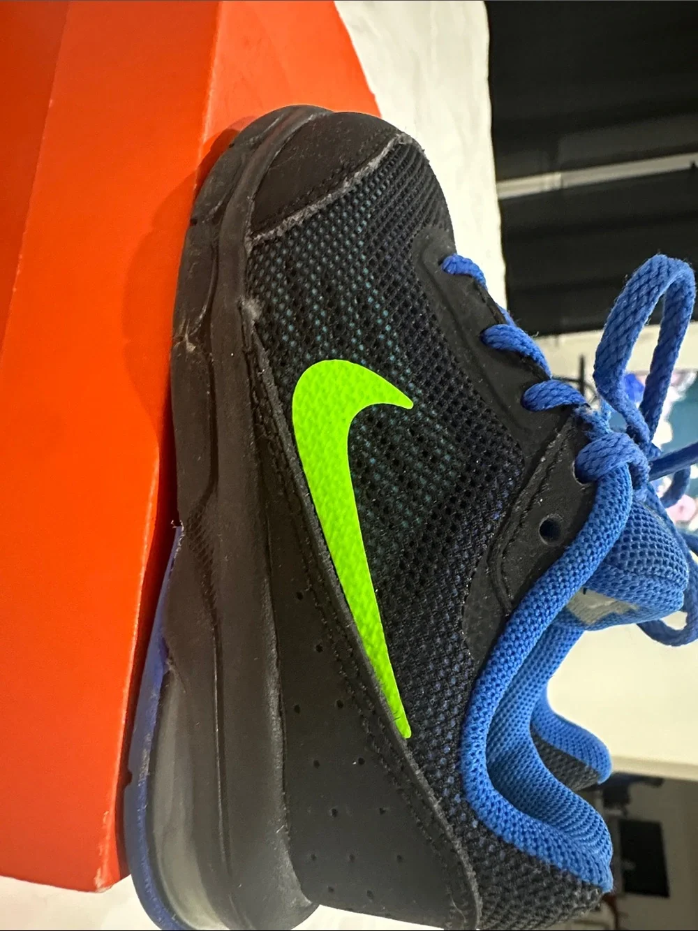 Nike Kids Black and Blue Athletic Sneakers with Neon Logo